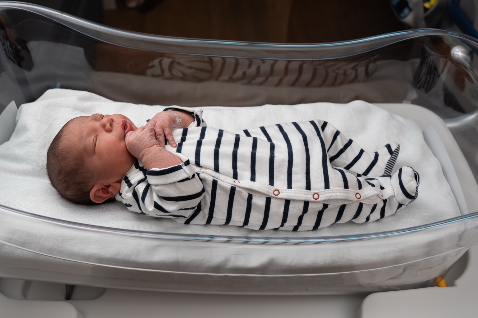 Eden Mousani Cohen resting in his hospital bassinet