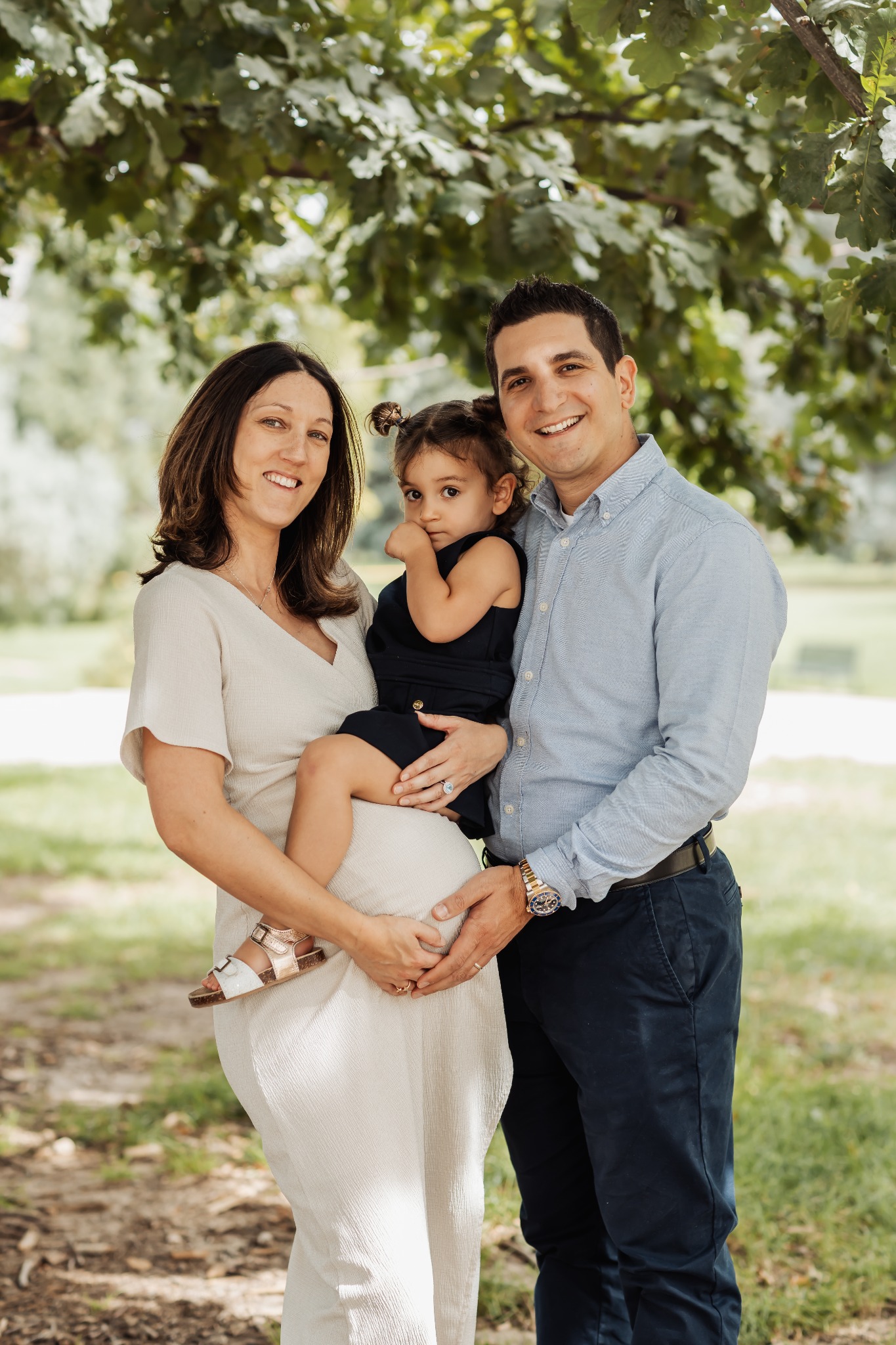 Family portrait beneath the trees